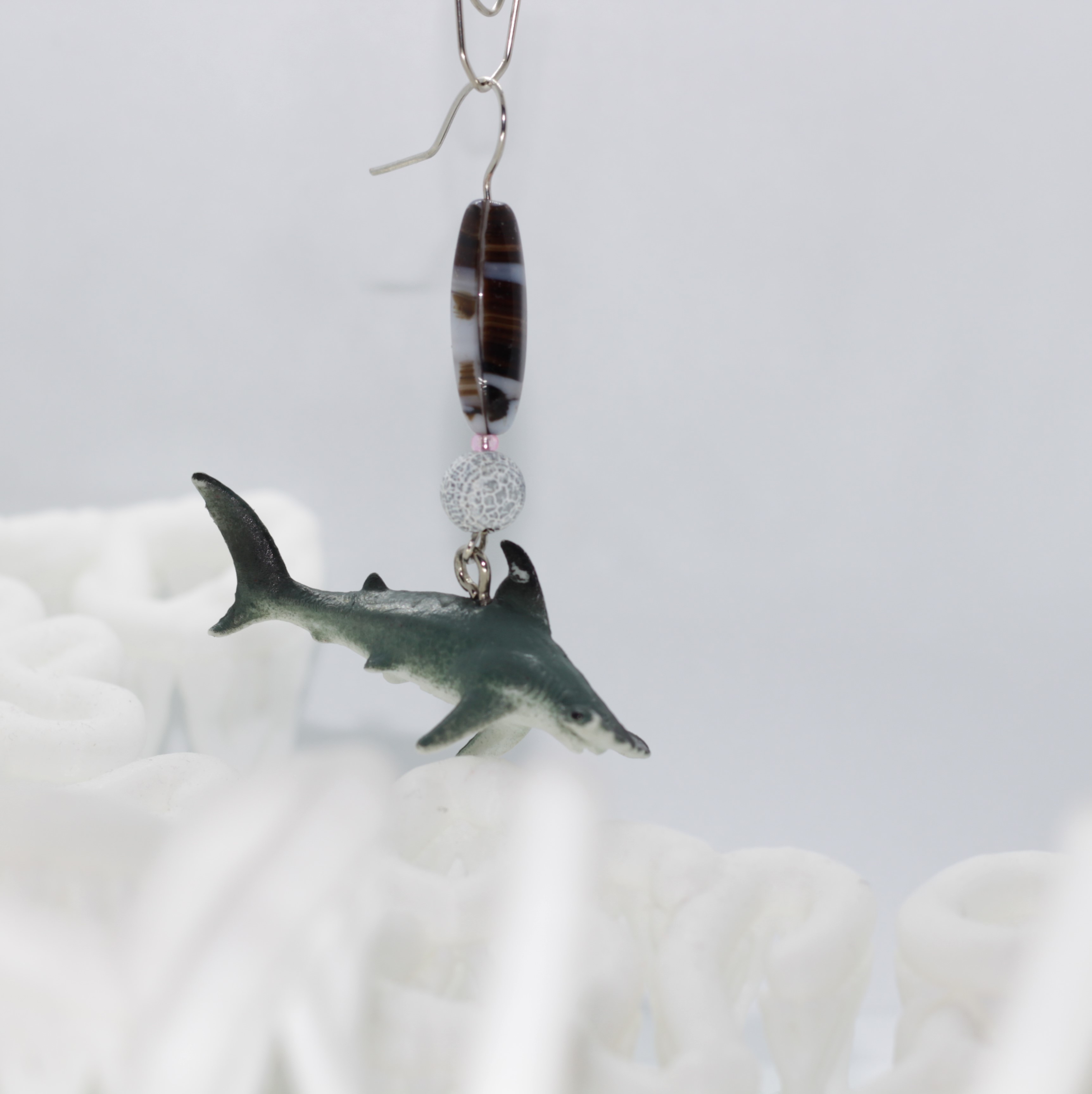 this is a caption for a shark earring